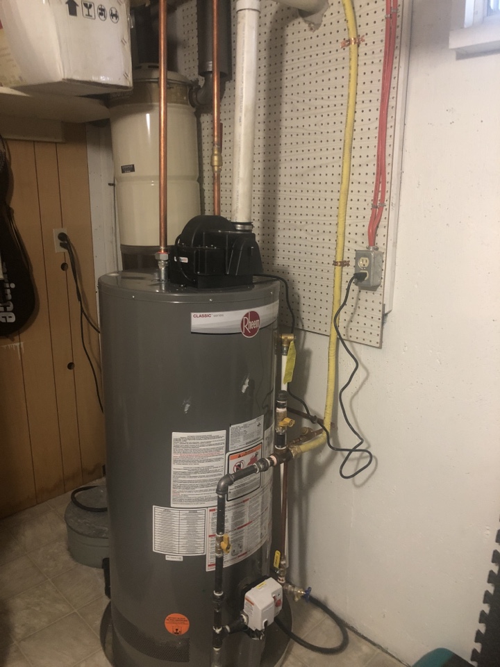 Calgary, AB - Plumbing required installed new hot water tank Rheem removed John wood hot tank And Ran lines From middle of basement to outside wall.